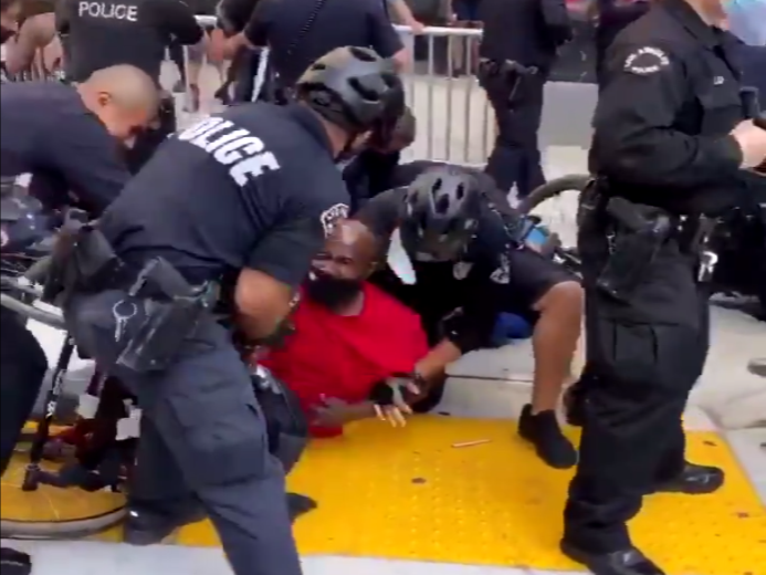 The police detain a man in a wheelchair at a Black Lives Matter protest in California: (@allykerans - Twitter)