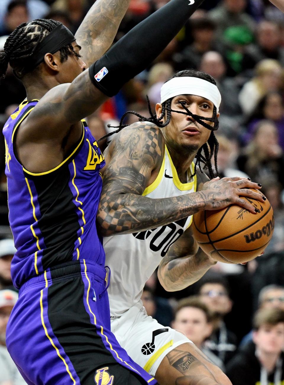 Utah Jazz guard Jordan Clarkson (00) works for a shot on Los Angeles Lakers forward Jarred Vanderbilt (2) as Utah and Los Angeles play at the Delta Center in Salt Lake City on Saturday, Jan. 13, 2024. | Scott G Winterton, Deseret News