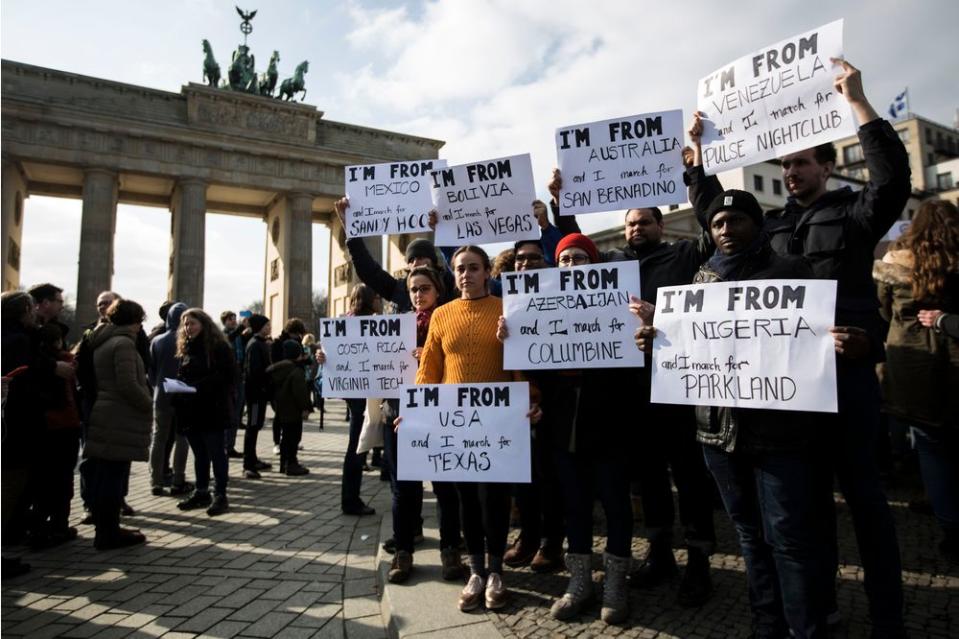 About 500 people gathered at Brandenburg Gate in the German capital to honor the victims of the Parkland massacre and call for stronger gun control in the United States.