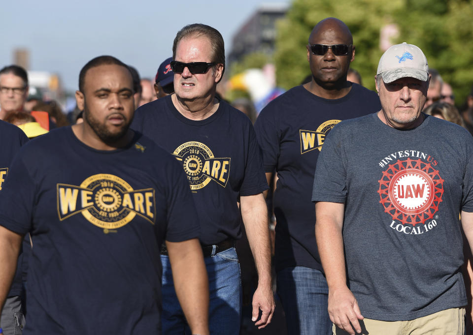 United Auto Workers President Gary Jones, center, whose home was searched by FBI agents Wednesday as part of a corruption probe, walks with UAW members during the first part of the annual Labor Day parade in downtown Detroit on Monday, Sept. 2, 2019. (Clarence Tabb Jr./Detroit News via AP)