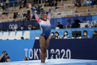 Simone Biles, of the United States, finishes on the balance beam during the artistic gymnastics women's apparatus final at the 2020 Summer Olympics, Tuesday, Aug. 3, 2021, in Tokyo, Japan. (AP Photo/Ashley Landis)