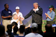 <p>Texas Governor Greg Abbott (L) reacts as President Donald Trump speaks at a church relief center during a visit with flood survivors and volunteers of Hurricane Harvey in Houston, Texas, Sept. 2, 2017. (Photo: Kevin Lamarque/Reuters) </p>