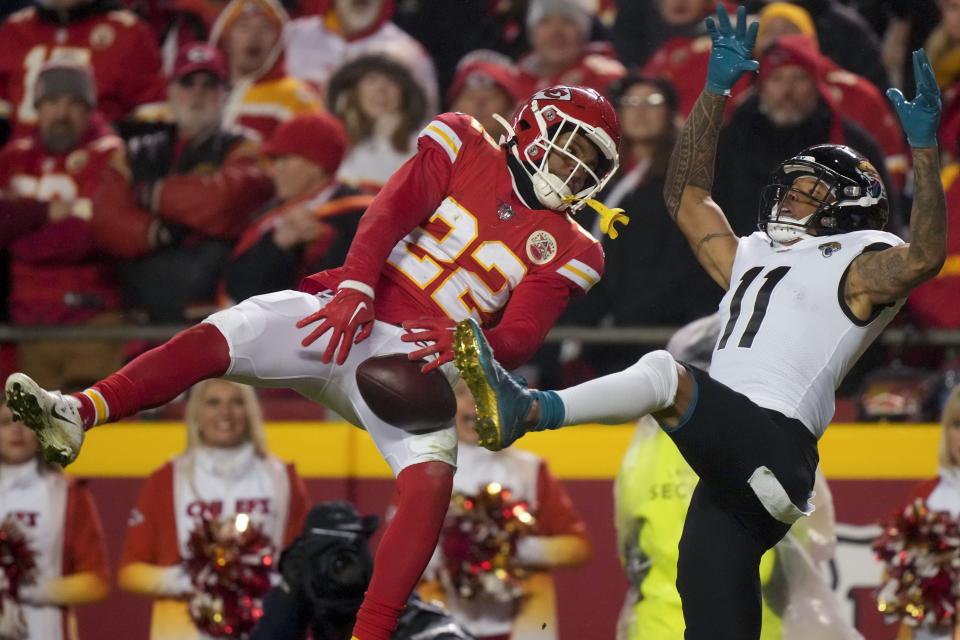 Kansas City Chiefs safety Juan Thornhill (22) breaks up a pass intended for Jacksonville Jaguars wide receiver Marvin Jones Jr. (11) in the end zone during the second half of an NFL divisional round playoff football game, Saturday, Jan. 21, 2023, in Kansas City, Mo. (AP Photo/Charlie Riedel)