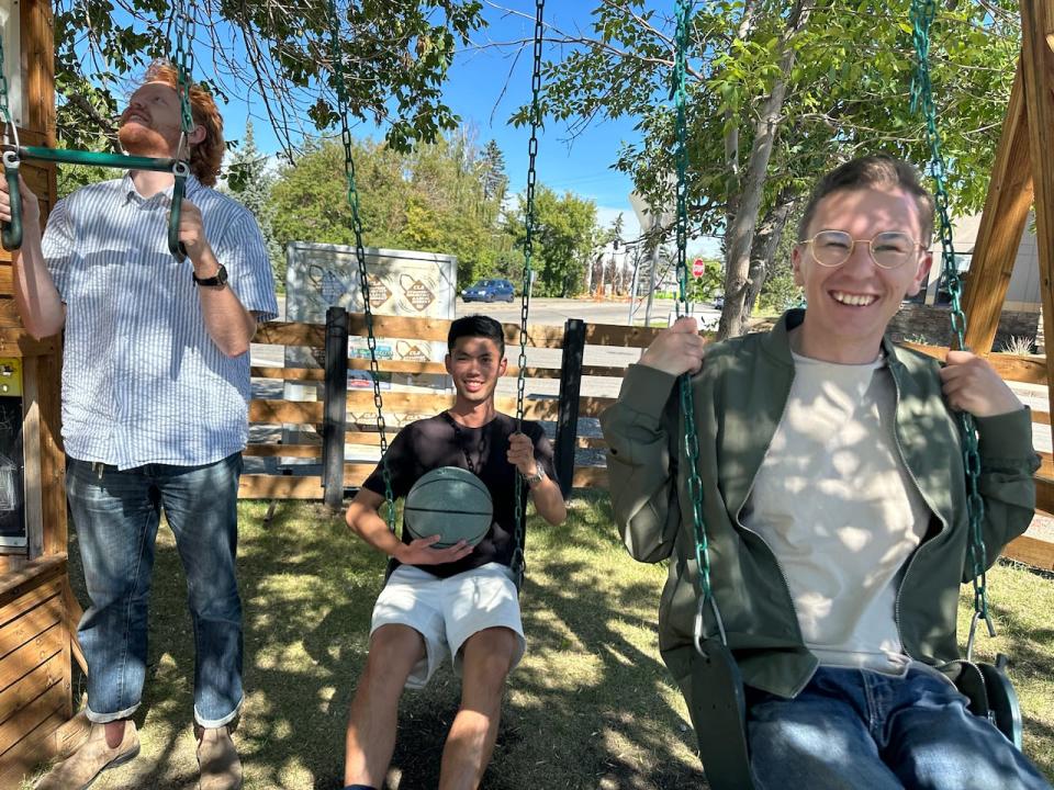 This children's playground is part of a new pop-up community space off Richmond Road in Calgary. From left to right, Adam Schwartz of the Federation for Calgary Communities, urban planning student Jeremy Pham and Christian Life Assembly community outreach director Jordan Illsley.