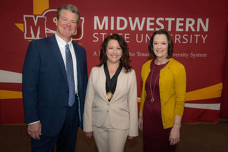 Candice Fulton, assistant chemistry professor at MSU, middle, was presented a teaching and research award. She is flanked by Texas Tech Chancellor Tedd L. Mitchell and MSU President Stacia Haynie.