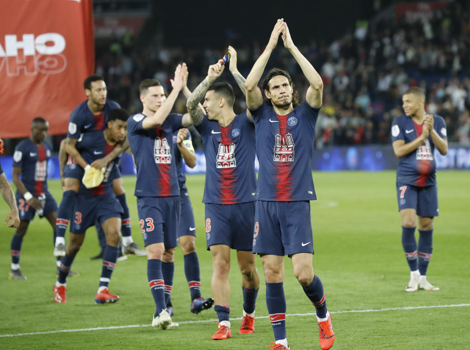 PSG's Edinson Cavani applauds supporters after the French League One soccer match between Paris-Saint-Germain and Monaco at the Parc des Princes stadium in Paris, Sunday April 21, 2019. PSG were celebrating winning the French League one title. (AP Photo/Michel Euler)