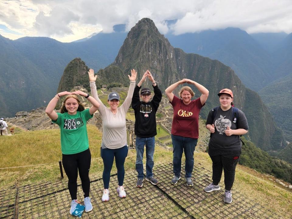 Participants in the Mapleton High School trip to Peru pose at Machu Picchu.