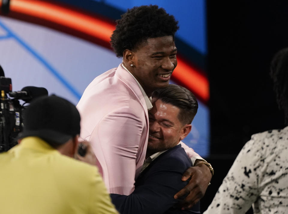 Kai Jones reacts after being selected as the 19th overall selection by the New York Knicks during the NBA basketball draft, Thursday, July 29, 2021, in New York. (AP Photo/Corey Sipkin)