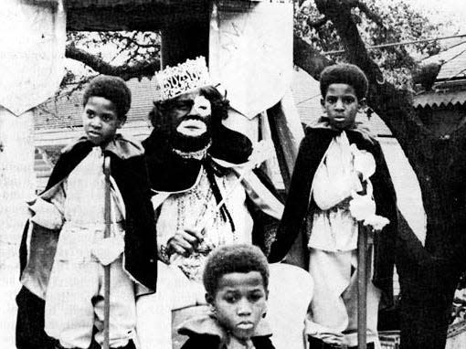 Shown aboard the title float of the 1973 Mardi Gras Parade of the Zulu Social Aid and Pleasure Club is Steve Johnson (King Zulu) and his royal pages