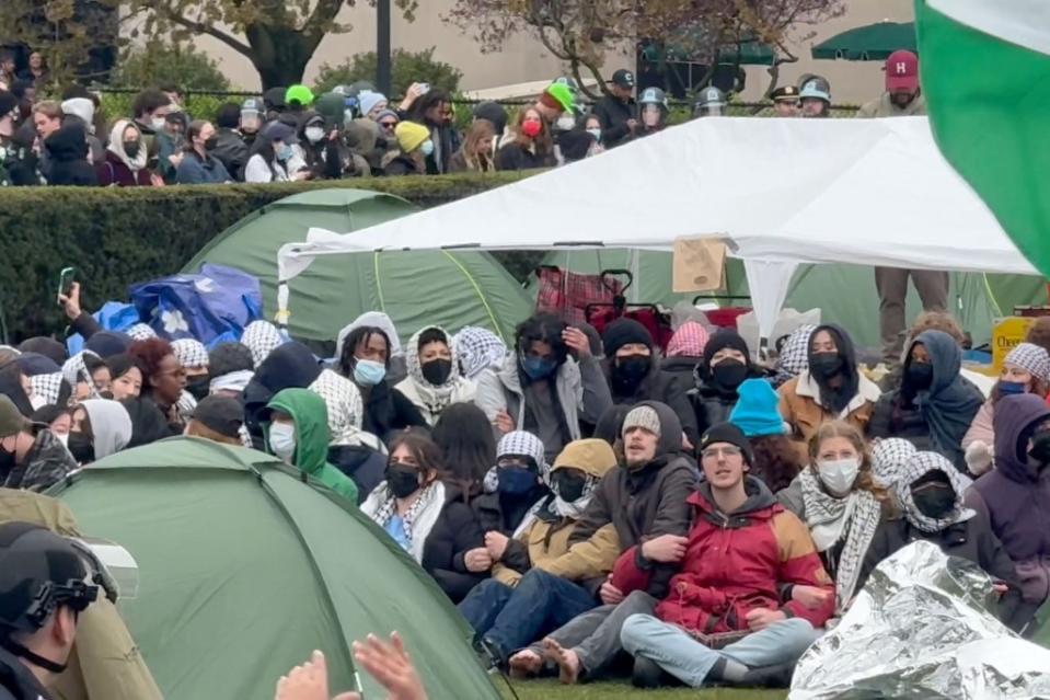 Demonstrators locked arms and chanted slogans from their makeshift tent cities they had erected on campus Wednesday. Robert Miller for NY Post