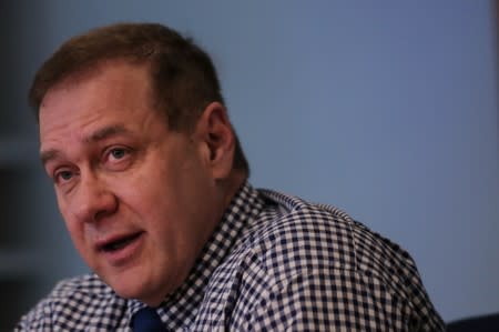 FILE PHOTO: Scott Minerd, Chairman of Guggenheim Investments and Global Chief Investment Officer, speaks during the Reuters Global Investment 2019 Outlook Summit, in New York