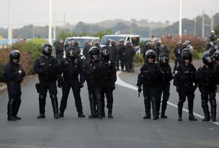 Police forces block the street as G7 summit opponents protest in Bayonne