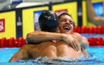 <b>Eric Shanteau</b><br>Shortly before Shanteau (right) competed in the 2008 Olympics, he learned he had testicular cancer. He put off treatment to compete, and afterward had surgery. Here, Shanteau celebrates with Brendan Hansen after they nabbed the top two spots in the 100 meter breaststroke to qualify for London. However, he was <a href="http://yhoo.it/KWC0IR" rel="nofollow noopener" target="_blank" data-ylk="slk:upset in the 200 breast event;elm:context_link;itc:0;sec:content-canvas" class="link ">upset in the 200 breast event</a>. (Al Bello/Getty Images)