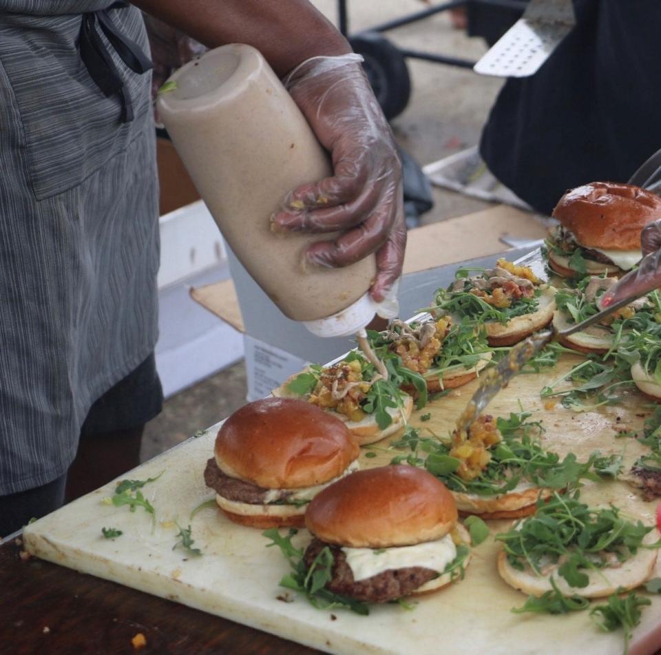 Coop Caribbean Fusion Caribbean burger with mango chutney and jerk mayo won Burger Battle Detroit Sunday at Eastern Market.