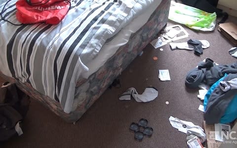 Matthew Falder's litter-strewn bedroom was raided by NCA officers - Credit: NCA/PA