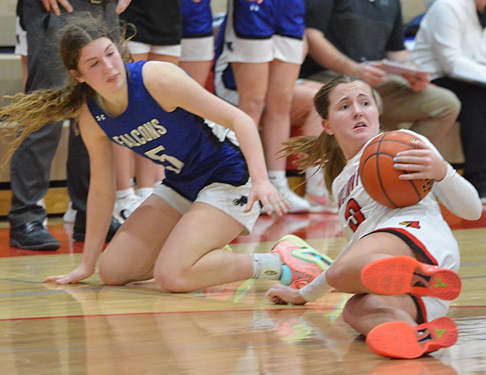 Arlington's Addie Steffensen controls the ball on the floor against Florence-Henry's Taylor Watson during their high school girls basketball game on Tuesday, Jan. 23, 2024 in Arlington. Arlington won 51-44.