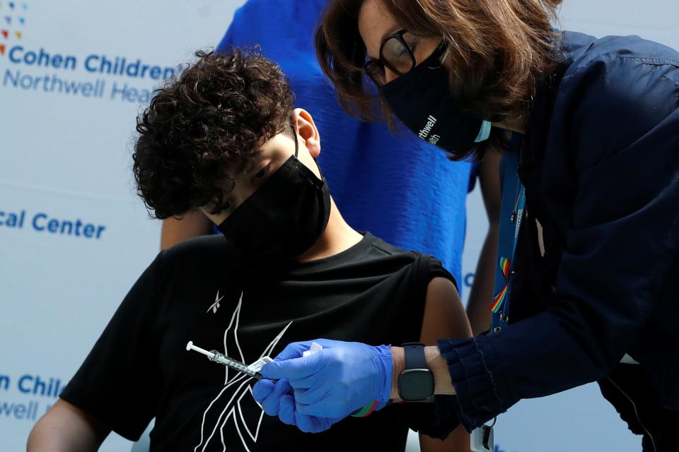 Michael Binparuis (15) of Nesconset, New York, is shown his dose of the Pfizer-BioNTech vaccine for the coronavirus disease (COVID-19) as children began receiving vaccinations at Northwell Health's Cohen Children's Medical Center in New Hyde Park, New York, U.S., May 13, 2021. REUTERS/Shannon Stapleton