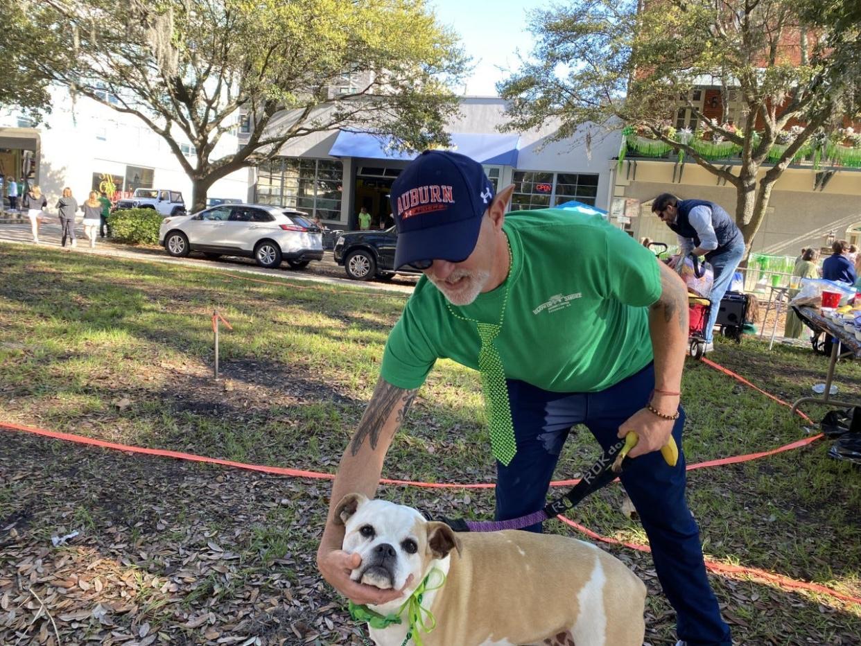 Shane Uhl from Daphne, Alabama, plays with his dog Pucca.