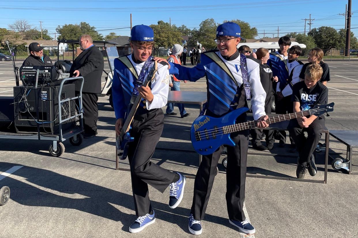 Chris Olguin, left, and Akbar Azua prepare to perform in the UIL Region 16 marching band competition on Saturday, Oct. 18, 2023, in Lubbock.