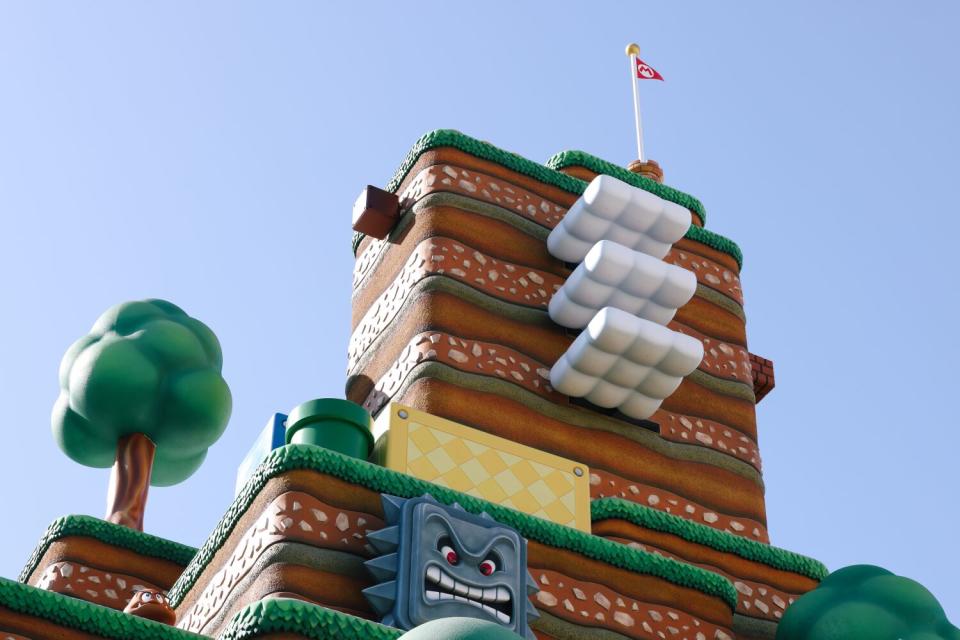 A terraced landscape topped by a red Mario flag.