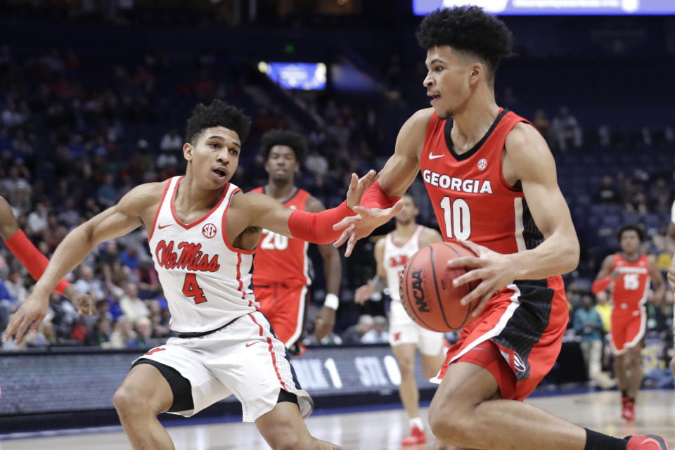 Georgia forward Toumani Camara (10) drives against Mississippi guard Breein Tyree (4) in the first half of an NCAA college basketball game in the Southeastern Conference Tournament Wednesday, March 11, 2020, in Nashville, Tenn. (AP Photo/Mark Humphrey)