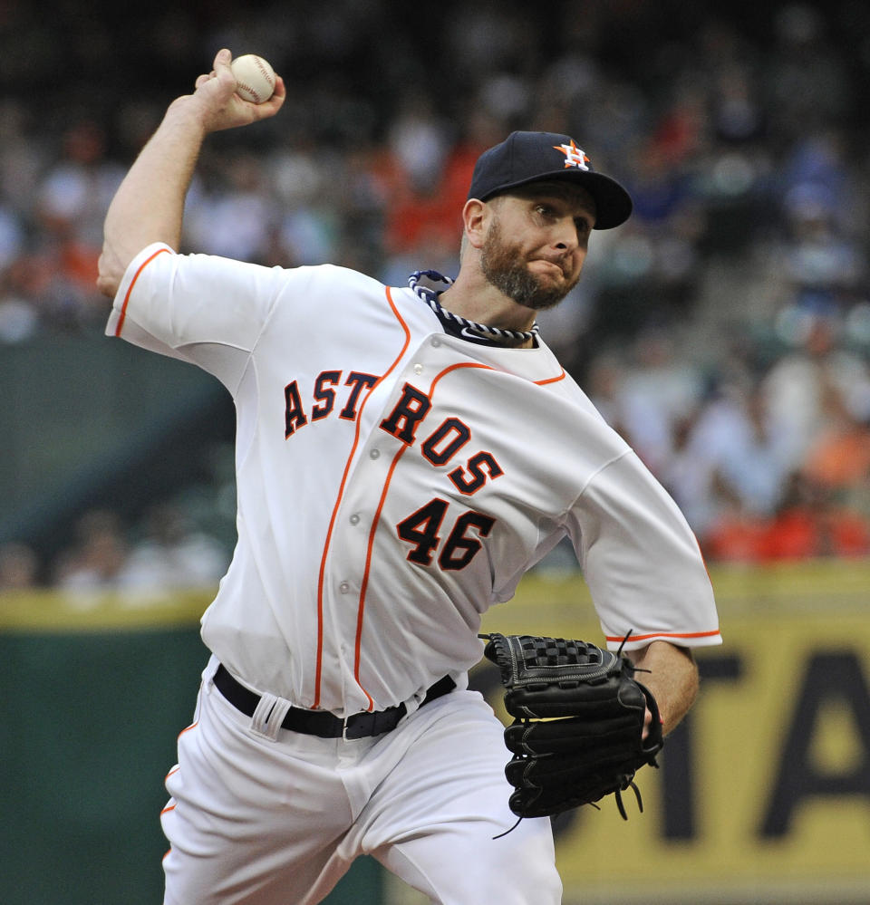 Houston Astros' Scott Feldman delivers a pitch against the New York Yankees in the first inning of a baseball game Tuesday, April 1, 2014, in Houston, on opening day for the teams. (AP Photo/Pat Sullivan)