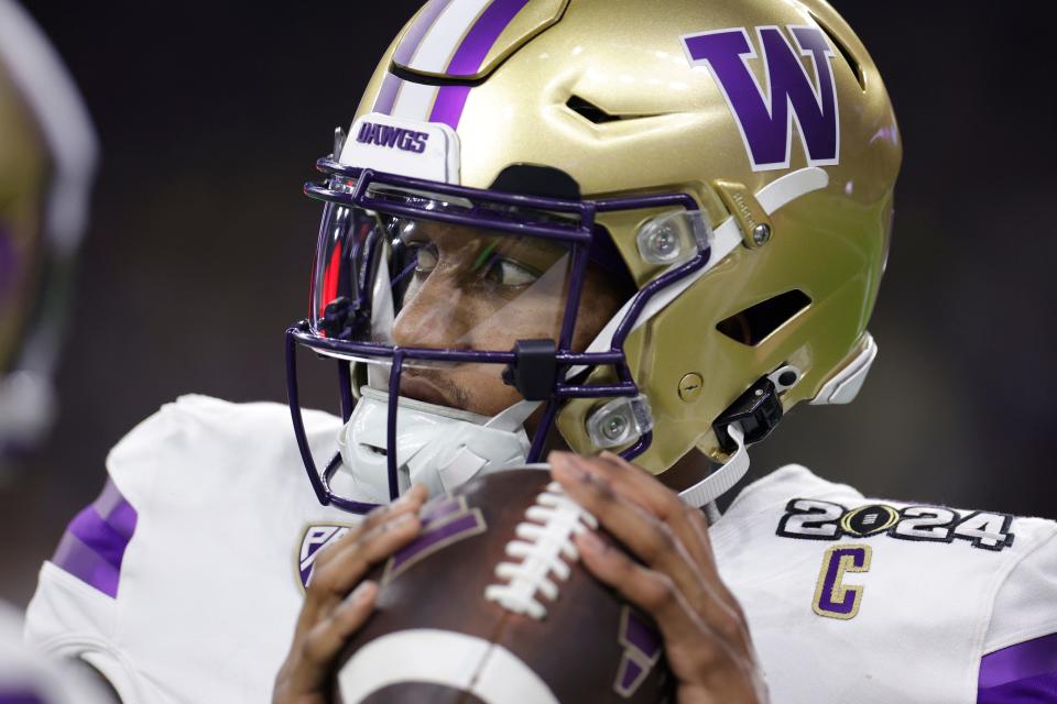 HOUSTON, TEXAS - JANUARY 08: Michael Penix Jr. #9 of the Washington Huskies throws the ball in the third quarter against the Michigan Wolverines during the 2024 CFP National Championship game at NRG Stadium on January 08, 2024 in Houston, Texas. (Photo by Carmen Mandato/Getty Images)