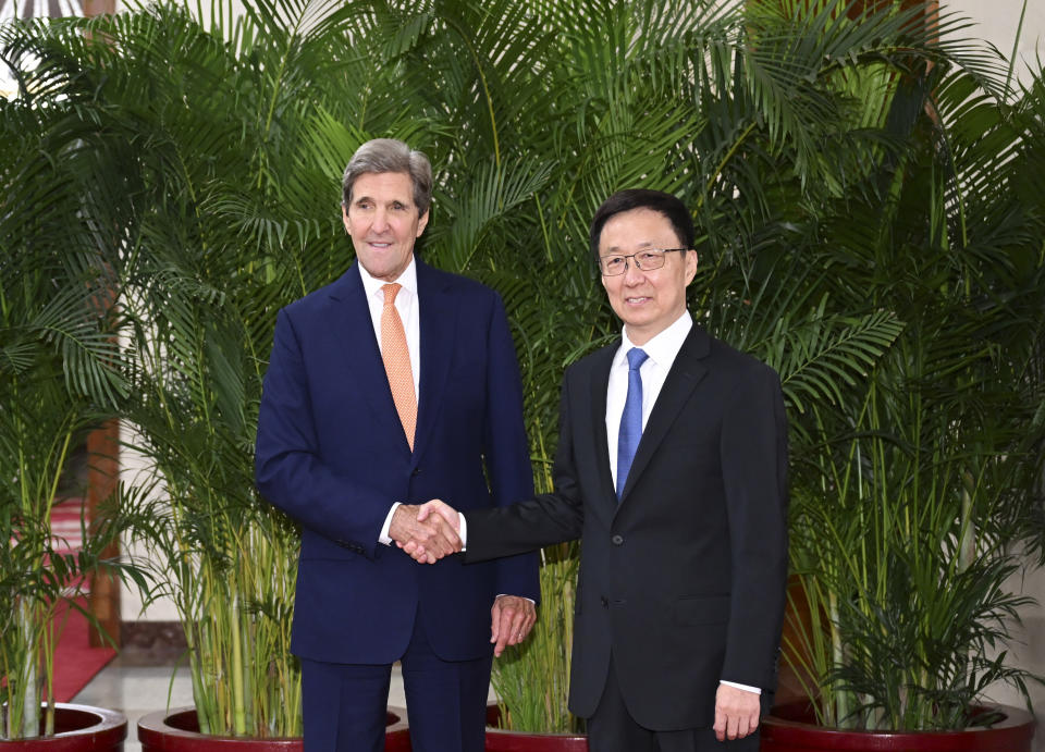 In this photo released by Xinhua News Agency, U.S. Special Presidential Envoy for Climate John Kerry, left, shakes hands with Chinese Vice President Han Zheng during a meeting in Beijing, Wednesday, July 19, 2023. China is willing to work with Washington on reducing global warming as long as its political demands are met, the country's vice president told U.S. climate envoy John Kerry on Wednesday. (Zhang Ling/Xinhua via AP)