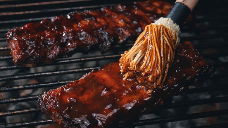 barbecue sauce slathered onto ribs