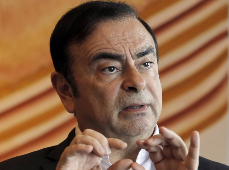 FILE - In this April 20, 2018, file photo, then Nissan Chairman Carlos Ghosn speaks during an interview in Hong Kong. Carole Ghosn, the wife of Nissan's former chairman Ghosn, has written a letter to Human Rights Watch, an advocacy group, on Monday, Jan. 14, 2019, criticizing his long detention and Japan's criminal justice system as unfair and harsh. Her letter describes how prosecutors interrogate prisoners without a lawyer present in an apparent effort to get a confession - conditions that are routine for suspects in Japan. (AP Photo/Kin Cheung, File)