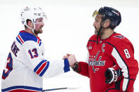 New York Rangers left wing Alexis Lafrenière (13) shakes hands with Washington Capitals left wing Alex Ovechkin (8) following Game 4 of an NHL hockey Stanley Cup first-round playoff series Sunday, April 28, 2024, in Washington. (AP Photo/Tom Brenner)