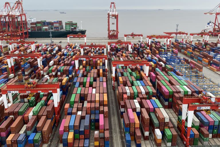 FILE ‚Äî The freight yard at Shanghai's port on June 17, 2021. The Biden administration said it would not immediately remove the Trump administration‚Äôs tariffs and would require that Beijing uphold its trade commitments. (Keith Bradsher/The New York Times)