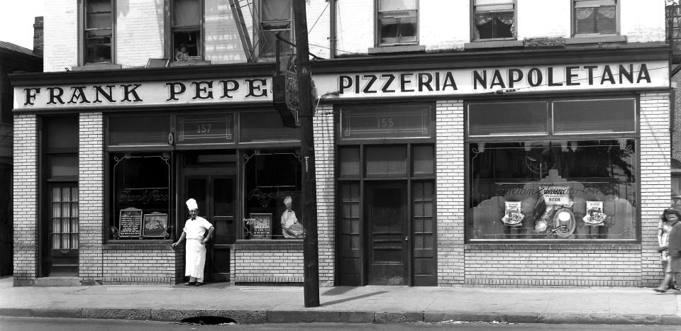 Francesco "Frank" Pepe stands outside his New Haven pizzeria. He founded the restaurant in 1925 and moved to this location in 1937. It continues to operate at that address.