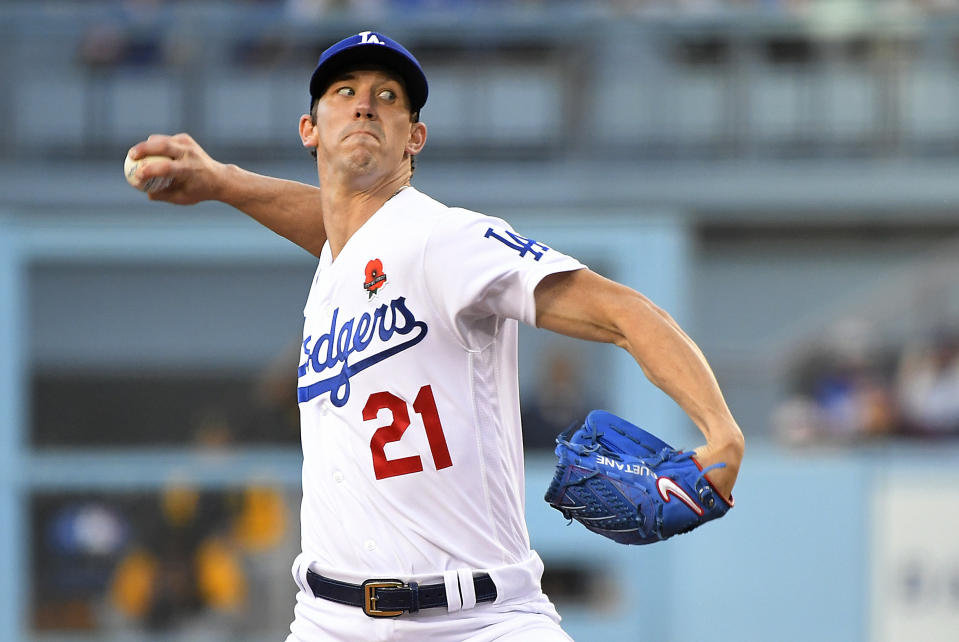 FILE - Los Angeles Dodgers starting pitcher Walker Buehler (21) throws against the Pittsburgh Pirates during the first inning of a baseball game Monday, May 30, 2022, in Los Angeles. Buehler found out Tommy John surgery is no longer a rarity but now routine.(AP Photo/John McCoy, File)