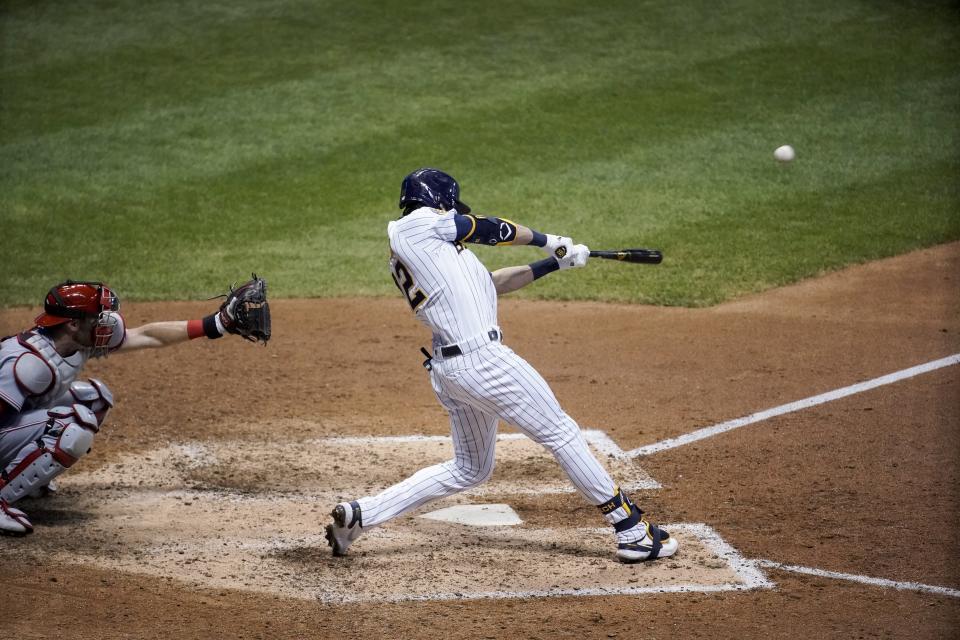 Milwaukee Brewers' Christian Yelich hits a two-run home run during the eighth inning of a baseball game against the Cincinnati Reds Friday, Aug. 7, 2020, in Milwaukee. (AP Photo/Morry Gash)