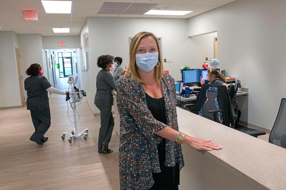 Chandra Smiley, CEO of Community Health Northwest Florida, gives a tour Monday of the organization's new facility on North Palafox Street.