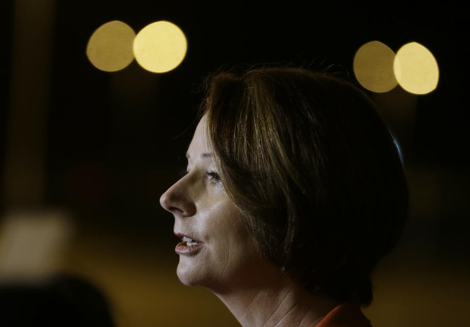 Australian Prime Minister Julia Gillard talks to reporters soon after her arrival at the APEC summit in Vladivostok, Russia, Friday, Sept. 7, 2012. (AP Photo/Mark Baker)