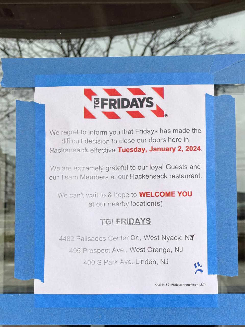 A sign on the door of TGI Fridays in Hackensack.