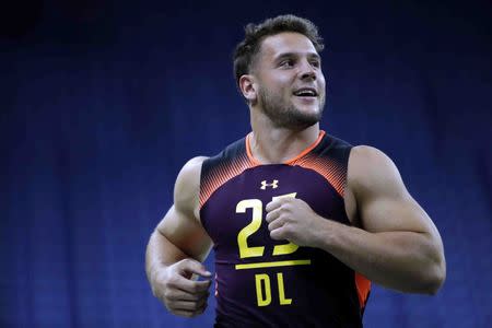 Mar 3, 2019; Indianapolis, IN, USA; Ohio State defensive lineman Nick Bosa (DL25) runs the 40 yard dash during the 2019 NFL Combine at Lucas Oil Stadium. Mandatory Credit: Brian Spurlock-USA TODAY Sports