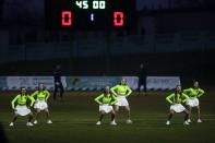 In this photo taken on Saturday, March 28, 2020, a support team dance during a break in the Belarus Championship soccer match between Gorodeya and Shakhter in the town of Gorodeya, Belarus. Longtime Belarus President Alexander Lukashenko is proudly keeping soccer and hockey arenas open even though most sports around the world have shut down because of the coronavirus pandemic. The new coronavirus causes mild or moderate symptoms for most people, but for some, especially older adults and people with existing health problems, it can cause more severe illness or death. (AP Photo/Sergei Grits)