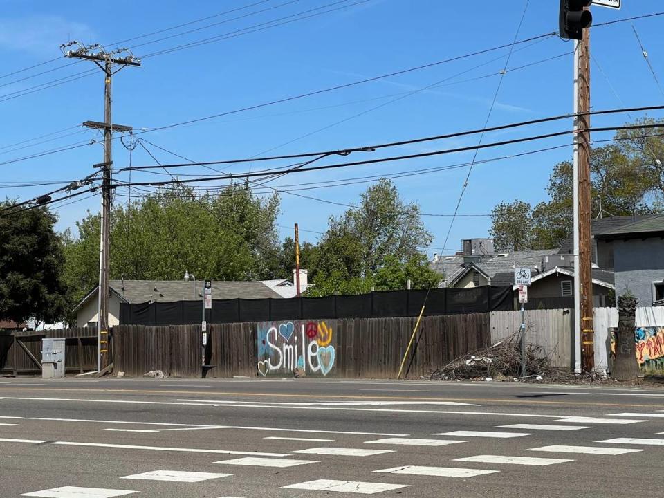 The word ‘smile’ is seen tagged on a fence on Carpenter Road in west Modesto on Tuesday, April 16.