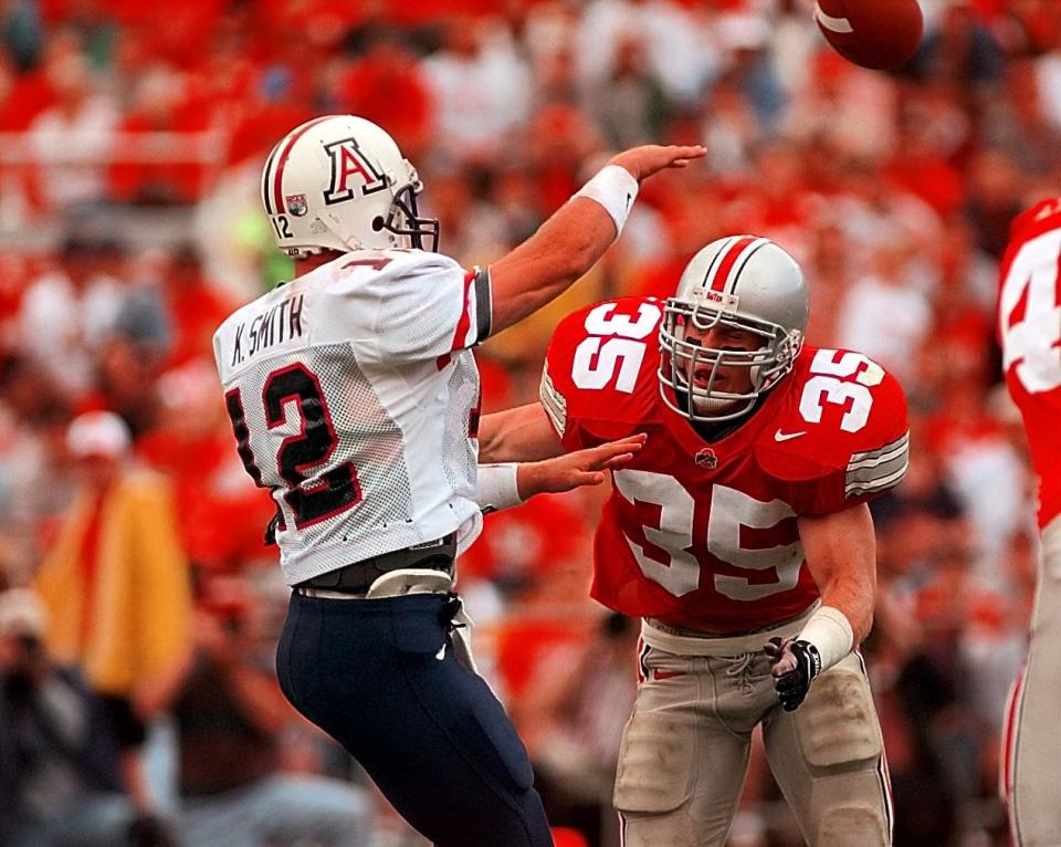 Ohio State linebacker Jerry Rudzinski pressures Arizona quarterback Keith Smith in a 1997 game.