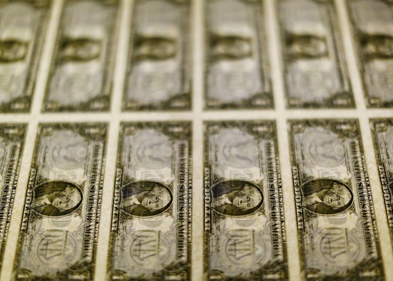 United States one dollar bills seen on a light table at the Bureau of Engraving and Printing in Washington