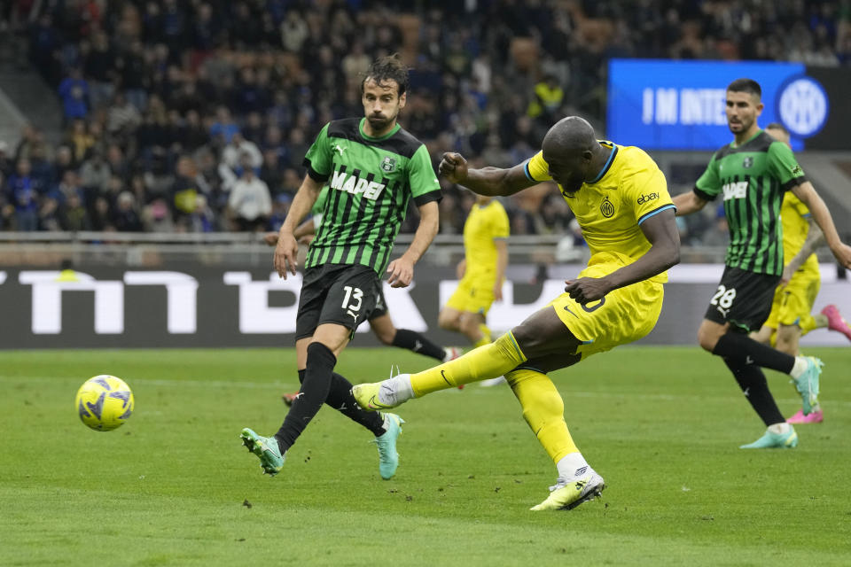 Inter Milan's Romelu Lukaku scores his side's fourth goal during the Serie A soccer match between Inter Milan and Sassuolo at the San Siro Stadium, in Milan, Italy, Saturday, May 13, 2023. (AP Photo/Antonio Calanni)