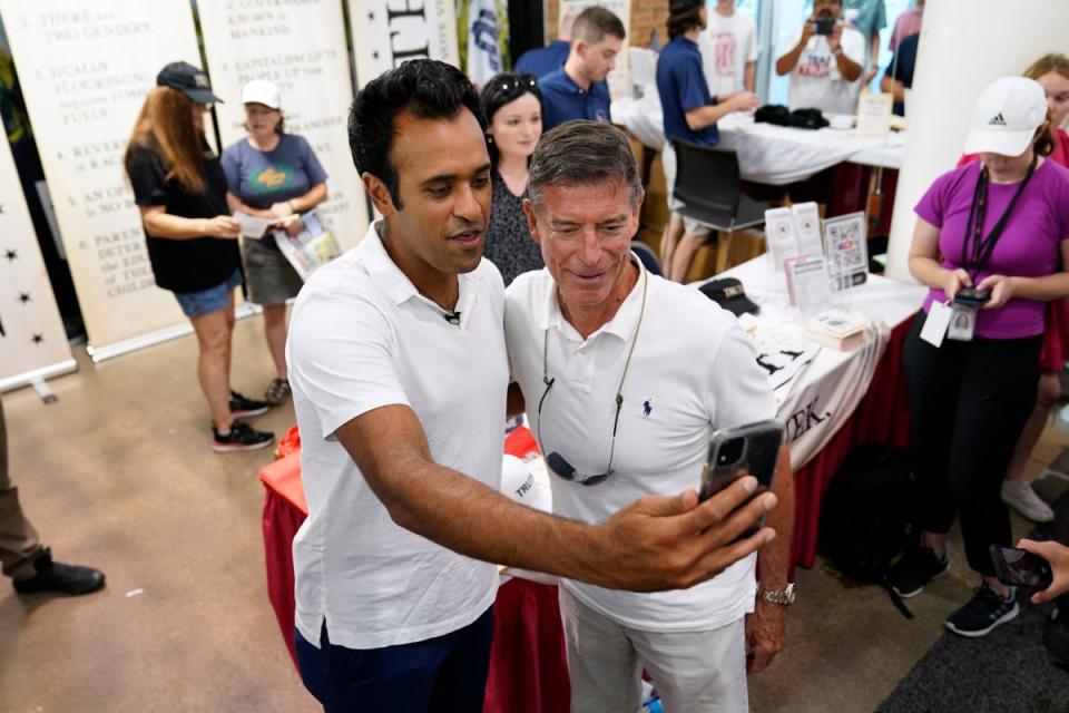 Republican presidential candidate businessman Vivek Ramaswamy poses for a photo with Chuck Ellis, right, of Birmingham, Alabama, at the Iowa State Fair, Friday, Aug. 11, 2023, in Des Moines, Iowa (Copyright 2023 The Associated Press. All rights reserved)