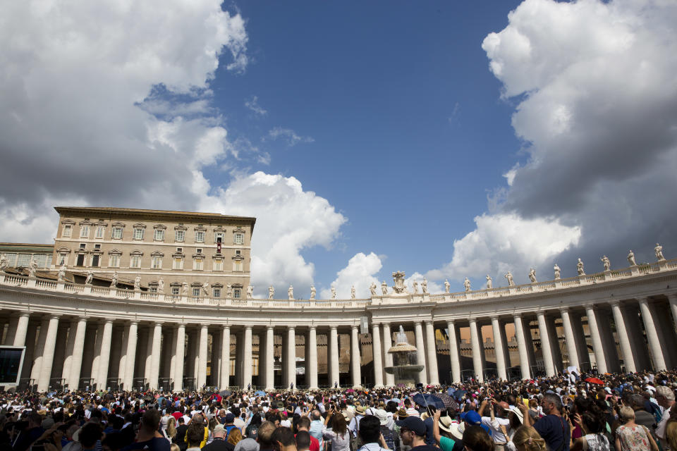 Faithful and pilgrims gather in St.Peter's Square, as Pope Francis recites the Angelus noon prayer from the window of his studio, at the Vatican, Sunday, Sept. 2, 2018. (AP Photo/Alessandra Tarantino)