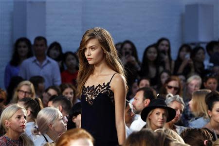 A model presents a creation from the Thakoon Spring/Summer 2014 collection during New York Fashion Week, September 8, 2013. REUTERS/Lucas Jackson