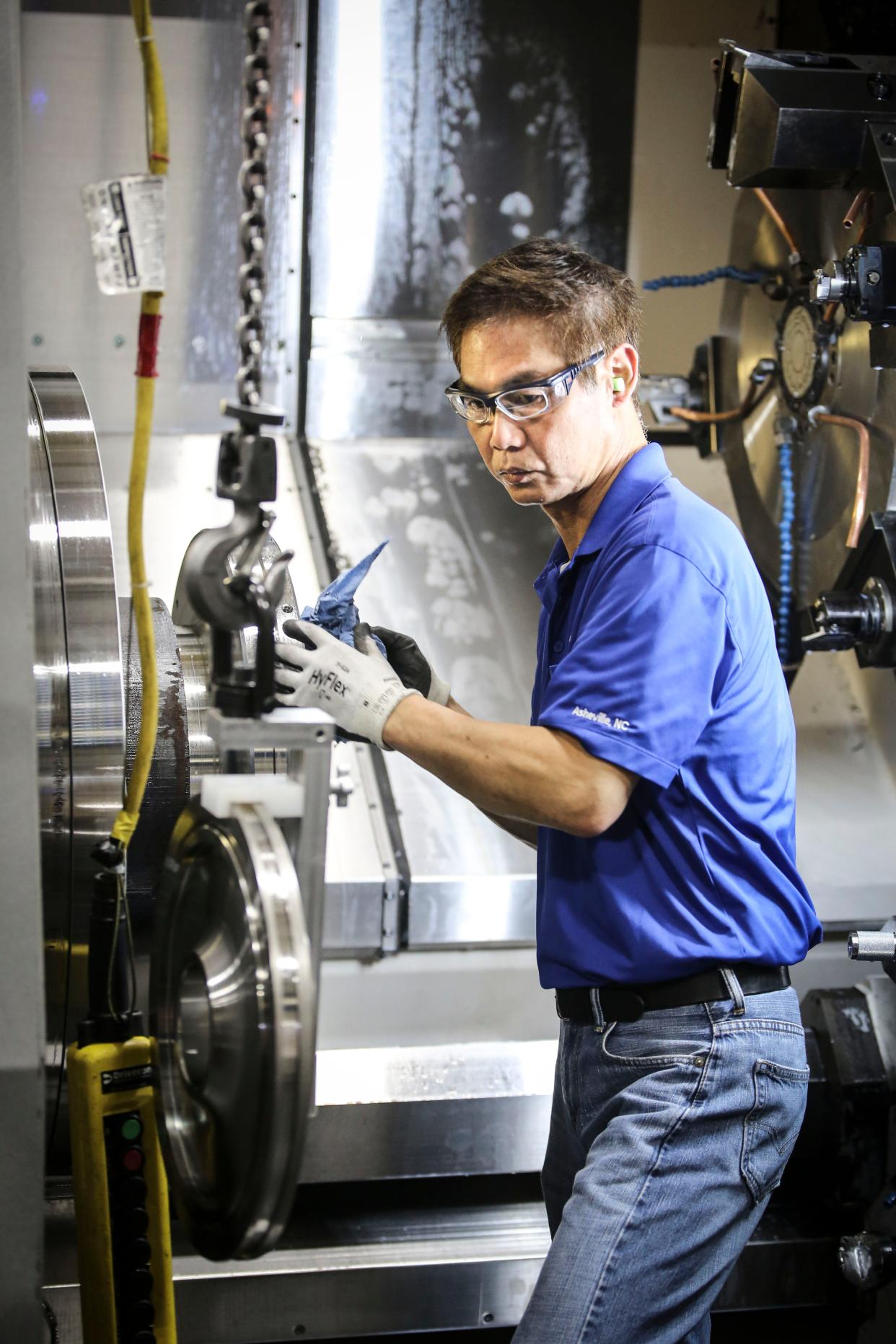 GE Aviation employee Loong Yap works at the company's facility in Asheville, which makes jet engine parts. GE Aviation in Asheville has more than 450 employees, and its employee base here has grown by around 200 employees over the last 10 years. The company has hired 30 more workers in the last six months.