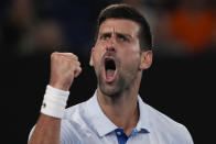 Serbia's Novak Djokovic celebrates after winning the third set against Croatia's Dino Prizmic during their first round match at the Australian Open tennis championships at Melbourne Park, Melbourne, Australia, Sunday, Jan. 14, 2024. (AP Photo/Andy Wong)