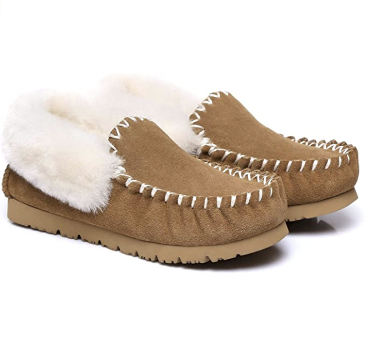 Ugg Australian Shepherd moccasins in light tan with folded down sheepskin lining and white stitching.